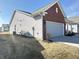 Home exterior showcasing siding with a brick accent and attached garage at 4889 Lilium Dr, Plainfield, IN 46168