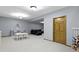 Finished basement offering space for recreation, with an open area that includes seating and a play area at 4978 St Charles Pl, Carmel, IN 46033
