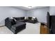 Finished basement boasts a sectional sofa and media center offering a relaxed space for leisure and entertainment at 4978 St Charles Pl, Carmel, IN 46033