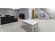 Carpeted basement area features a gray sofa, media center, play table, and bookshelf for plenty of flexible space at 4978 St Charles Pl, Carmel, IN 46033