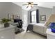 Comfortable bedroom with a vaulted ceiling, a desk, a window, and light grey walls at 4978 St Charles Pl, Carmel, IN 46033