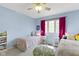Charming bedroom with colorful decor, two beds, and a ceiling fan with a light at 4978 St Charles Pl, Carmel, IN 46033