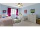Charming bedroom with colorful decor, two beds, and a ceiling fan with a light at 4978 St Charles Pl, Carmel, IN 46033