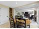 Dining area adjacent to the kitchen and open to the living room with a fireplace at 4978 St Charles Pl, Carmel, IN 46033