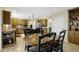 Dining area and kitchen combination with ample counter space and wooden cabinets at 4978 St Charles Pl, Carmel, IN 46033