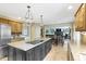 Kitchen with island featuring granite countertops, stainless steel appliances, and an open layout at 4978 St Charles Pl, Carmel, IN 46033