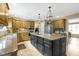 Well-equipped kitchen with a large island, custom cabinetry, and stainless steel refrigerator at 4978 St Charles Pl, Carmel, IN 46033