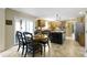 Bright eat-in kitchen features a center island, modern appliances, tile floors and glass doors to the deck at 4978 St Charles Pl, Carmel, IN 46033