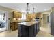 Spacious kitchen featuring an island with granite countertop and stainless steel appliances at 4978 St Charles Pl, Carmel, IN 46033
