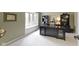 This home office features a large desk, hardwood floors, a bay window, and built-in cabinets at 4978 St Charles Pl, Carmel, IN 46033