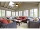 Bright sunroom features wicker furniture, ceiling fan, and skylight creating a warm and inviting atmosphere at 4978 St Charles Pl, Carmel, IN 46033