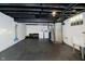 Unfinished basement with a laundry area, utility sink, and ample storage space at 536 W 52Nd St, Indianapolis, IN 46208