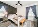 Stylish bedroom with a decorative accent wall, comfortable bed, and modern furnishings at 536 W 52Nd St, Indianapolis, IN 46208