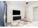 Comfortable bedroom with an area rug, a wall-mounted TV, and modern decorations at 536 W 52Nd St, Indianapolis, IN 46208