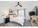 Inviting bedroom with a comfortable bed, decorative rug, and a stylish ceiling fan at 536 W 52Nd St, Indianapolis, IN 46208