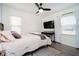 Inviting bedroom with a patterned rug, accent wall, and a comfortable bed at 536 W 52Nd St, Indianapolis, IN 46208