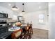 Modern kitchen with granite counters, stainless steel appliances, and breakfast bar seating at 536 W 52Nd St, Indianapolis, IN 46208