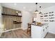 Charming kitchen with wood accents, a breakfast bar with pendant lighting, and a stylish wine rack at 536 W 52Nd St, Indianapolis, IN 46208