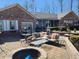 Inviting brick patio with a fire pit and comfortable seating, perfect for outdoor entertaining at 551 E 600 S, Lebanon, IN 46052