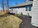 Well-maintained backyard features tasteful landscaping, a manicured lawn and mulched garden at 551 E 600 S, Lebanon, IN 46052