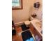 Cozy bathroom with blue-themed wallpaper and vanity with sink at 551 E 600 S, Lebanon, IN 46052