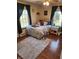 Sunlit bedroom with hardwood floors and simple decor at 551 E 600 S, Lebanon, IN 46052