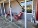 Inviting front porch with colorful chairs and welcome sign at 551 E 600 S, Lebanon, IN 46052