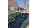 Brick home with manicured front yard and decorative tree at 551 E 600 S, Lebanon, IN 46052