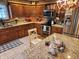 Inviting kitchen with custom wood cabinets, granite countertops, and modern stainless steel appliances at 551 E 600 S, Lebanon, IN 46052