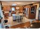 Spacious kitchen featuring custom wood cabinets, a granite-topped island, and stainless steel appliances at 551 E 600 S, Lebanon, IN 46052