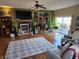 Spacious living room with a fireplace, hardwood floors, and a ceiling fan at 551 E 600 S, Lebanon, IN 46052