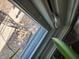 Close-up of a window featuring a screen and white frame, offering natural light at 551 E 600 S, Lebanon, IN 46052