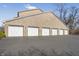 Spacious six-car garage with white doors, perfect for car enthusiasts or extra storage at 6525 Emerald Hill Ct # 207, Indianapolis, IN 46237
