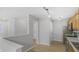 Bright kitchen featuring stainless steel appliances, granite countertops, and wood cabinetry at 6525 Emerald Hill Ct # 207, Indianapolis, IN 46237