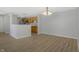 Open concept space showcasing a kitchen area, living room with a chandelier, and modern finishes at 6525 Emerald Hill Ct # 207, Indianapolis, IN 46237