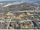 Wide aerial view of the neighborhood showcasing the houses, trees, and residential road network of the community at 6603 Iona Rd, Indianapolis, IN 46203