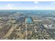 Expansive aerial view of the property with a picturesque pond and surrounding landscape at 6603 Iona Rd, Indianapolis, IN 46203