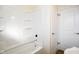 Bathroom view of a shower/tub combination and a door into the room at 6603 Iona Rd, Indianapolis, IN 46203