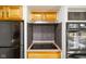 Cooktop and double oven, set against a modern backsplash, with overhead cabinets and a stainless range hood at 6603 Iona Rd, Indianapolis, IN 46203