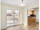 Bright dining area featuring sliding glass doors to a deck and an open view to the kitchen at 6603 Iona Rd, Indianapolis, IN 46203