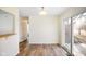 Open dining area with modern flooring and access to the backyard through sliding glass doors at 6603 Iona Rd, Indianapolis, IN 46203