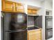 View of kitchen appliances including refrigerator, cooktop and double oven with overhead cabinets at 6603 Iona Rd, Indianapolis, IN 46203