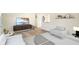 Cozy living room featuring modern furniture, a stylish entertainment center, and natural light at 6603 Iona Rd, Indianapolis, IN 46203