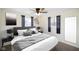 Serene main bedroom featuring neutral colors, soft lighting, and plush bedding at 6603 Iona Rd, Indianapolis, IN 46203