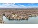 Beautiful aerial view showcasing lakefront properties, docks and boats amidst a dense forest at 6655 Gopher Dr, Nineveh, IN 46164