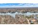 Aerial view showing the lake community surrounded by trees and waterfront properties at 6655 Gopher Dr, Nineveh, IN 46164