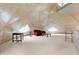 Spacious attic displaying unique wood architecture, neutral carpet, and comfortable seating arrangement at 6655 Gopher Dr, Nineveh, IN 46164