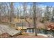 Backyard area with wood decks and stairs leading to the water and boat docks at 6655 Gopher Dr, Nineveh, IN 46164