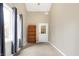 Bright bedroom featuring natural light, carpet, a bookcase, and a white door to the exterior at 6655 Gopher Dr, Nineveh, IN 46164