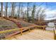 Enjoy lake views from this spacious deck with steps to water access and cozy seating areas at 6655 Gopher Dr, Nineveh, IN 46164